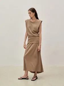 Detailed texture of khaki sleeveless top and matching maxi skirt co-ord set