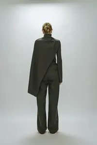 Rear view of grey high-neck top with asymmetrical draped shawl and matching trousers