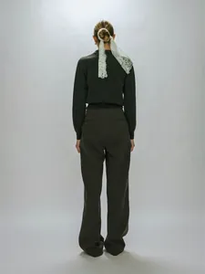 Rear view of model wearing charcoal grey knit polo top and matching straight-leg trousers