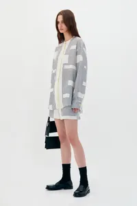 Detailed full-body view of a cream geometric print shirt and shorts co-ord set