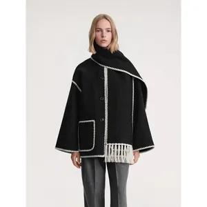 Women's black wool scarf jacket with contrast blanket stitching and fringe detailing
