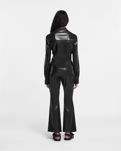 Rear full view of women's premium black leather shirt and matching flared trousers set