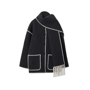 Dark grey wool coat with integrated scarf, fringe tassels and white contrast stitching