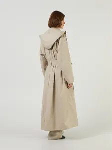 Detailed back view of a khaki long trench coat with pleated back design and a hood