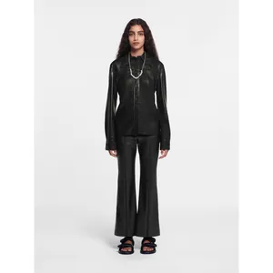 Women's black faux leather shirt and flared trousers set with buttons and topstitching