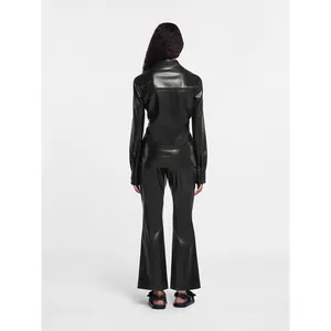 Rear view of a chic black faux leather two-piece long sleeve shirt and pants set
