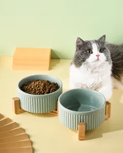 Dual ceramic cat bowls with bamboo stand featuring vertical stripe texture and raised frame