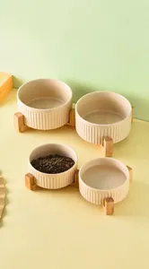 Ceramic pet bowls with bamboo stand featuring vertical stripe relief and stone texture