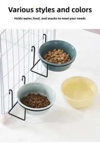 Hanging ceramic pet bowls in blue and yellow with black metal cage mounts for food and water
