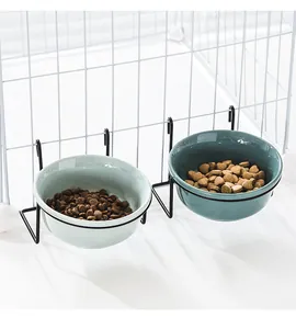 Hanging ceramic pet bowls in green with double metal hooks for cage mounting