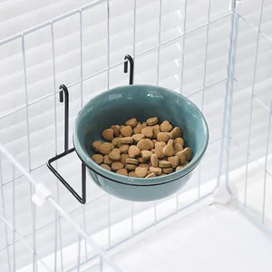 Hanging ceramic cat bowl with black metal cage mount and heart-shaped pet food