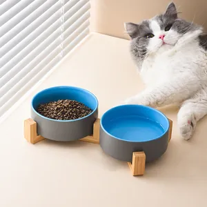Dual ceramic cat bowls with wooden stand for elevated neck protection and dry food water