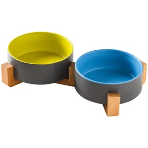 Ceramic pet double bowl set with dark grey exterior and bamboo wood stand for cats and dogs