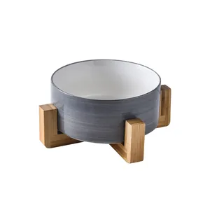 Ceramic pet bowl with grey brushed texture and elevated cross wooden stand for cats and dogs