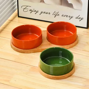 Ceramic cat bowl set with bamboo stand in orange and green for neck protection