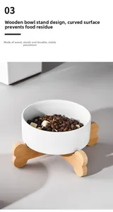 Close-up of ceramic cat bowl with bone-shaped wooden stand and curved inner surface