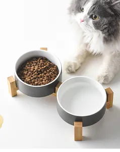 Elevated bamboo stand with two ceramic pet bowls for food and water protection