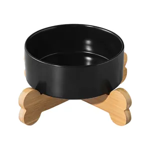 Modern black ceramic elevated cat bowl with ergonomic bone-shaped bamboo wood stand