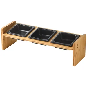 Three-bowl bamboo stand with black square ceramic cat bowls for ergonomic feeding