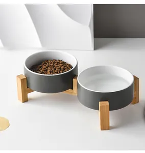 Detail of raised bamboo stand with two ceramic pet bowls for food and water