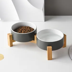 Elevated double ceramic cat bowls with bamboo stand for neck protection and feeding