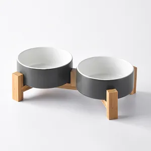 Elevated double ceramic pet bowl set with dark grey matte finish and bamboo wood stand