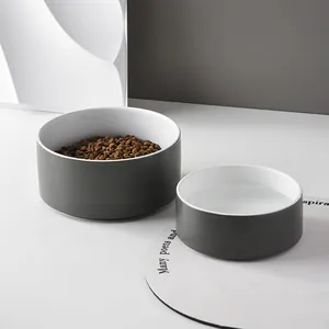 Minimalist ceramic pet double bowl set with dark grey matte finish and wooden stand