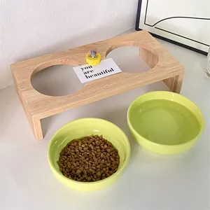 Solid wood elevated pet double bowl station with green ceramic bowls for cats and dogs