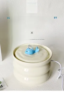 Detail of all-ceramic automatic pet fountain with whale design and constant temperature