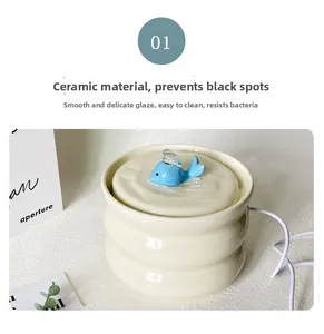 Detail of cream ceramic pet water fountain with blue whale pump and smooth glaze
