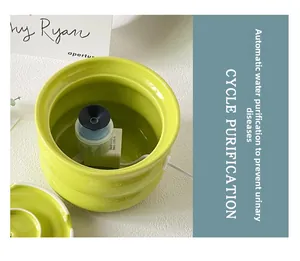 Detail view of the green ceramic pet fountain showing the 120L/h electric water pump system