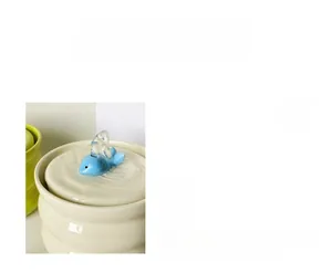Detail of quiet ceramic pet water fountain featuring a whale fountain head and low-noise pump