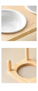 Detail of white ceramic pet bowl with natural bamboo elevated stand for neck protection