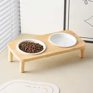 Elevated double ceramic cat bowls with light wood stand for pet neck protection