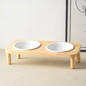 Minimalist elevated wooden stand with double ceramic bowls for cat neck protection