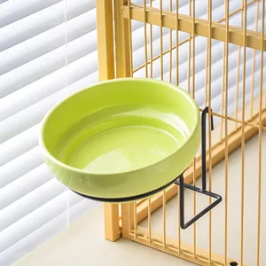 Hanging green ceramic pet bowl with black metal hook stand for bird cages and crates
