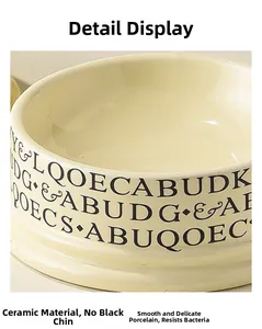 Detailed view of cream ceramic pet bowl with smooth glaze and black letter accents