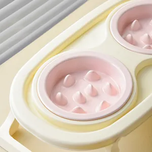 Écuelles doubles anti-glouton pour animaux en jaune et rose avec base à colonnes fixe