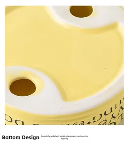 Detailed view of the yellow ceramic cat bowl base with anti-slip design and stable structure