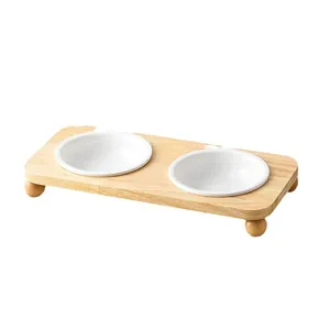 Minimalist double ceramic cat bowls with natural wood stand for food and water