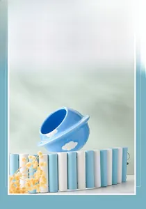 Blue ceramic planet-shaped hamster hideout with star ring and white cloud pattern