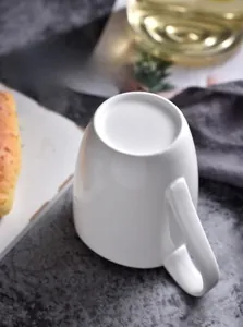 Detail of unglazed non-slip bottom on white ceramic mug for anti-scratch protection