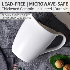 Minimalist white ceramic coffee mug with handle, heat-resistant and microwave-safe
