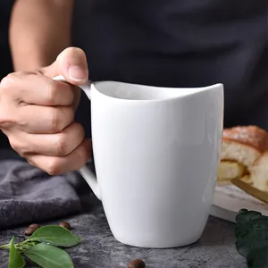 Minimalist white ceramic mug with asymmetric wavy rim and handle for coffee and tea