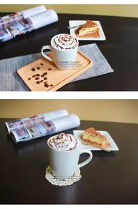 Minimalist white ceramic mug on a wooden tray with coffee beans and a side of cake