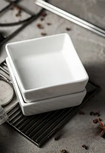 Stackable white square ceramic spice bowls in a minimalist modern kitchen setting