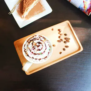 Rectangular light-colored solid wood tray with natural grain for coffee and afternoon tea