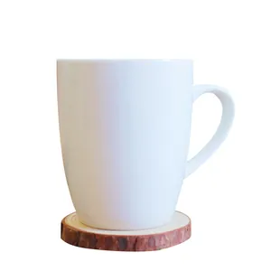 Minimalist white ceramic coffee mug set with a natural round wooden coaster base