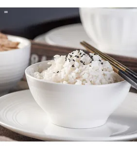 Detail of white ceramic rice bowl with spiral texture and thick heat-resistant wall