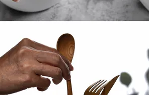 Close-up of a hand holding a polished natural wood spoon with clear grain texture